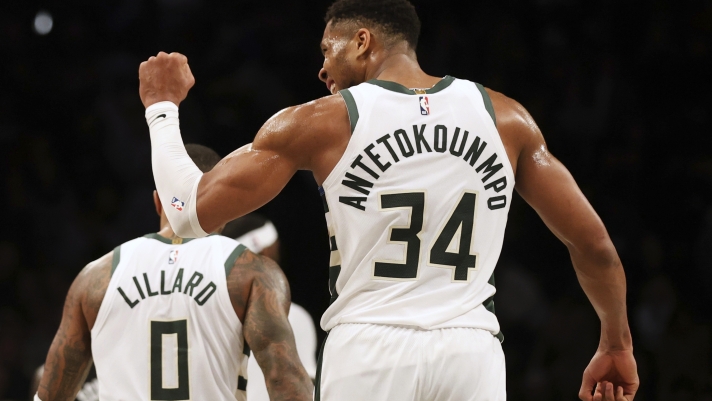 Milwaukee Bucks' Giannis Antetokounmpo reacts towards the bench during the second half of an NBA basketball game against the Brooklyn Nets, Sunday, Dec. 8, 2024, in New York. (AP Photo/Heather Khalifa)