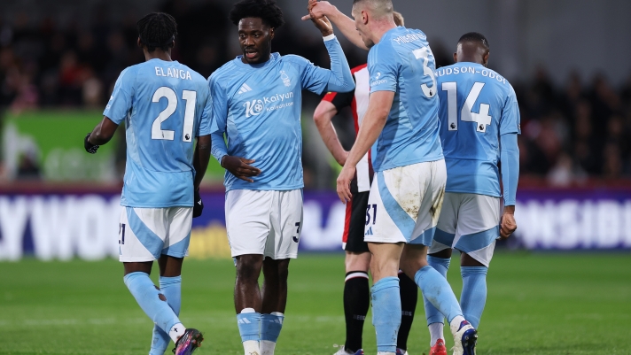 BRENTFORD, ENGLAND - DECEMBER 21: Ola Aina of Nottingham Forest celebrates scoring his team's first goal with teammates during the Premier League match between Brentford FC and Nottingham Forest FC at Gtech Community Stadium on December 21, 2024 in Brentford, England. (Photo by Ryan Pierse/Getty Images)