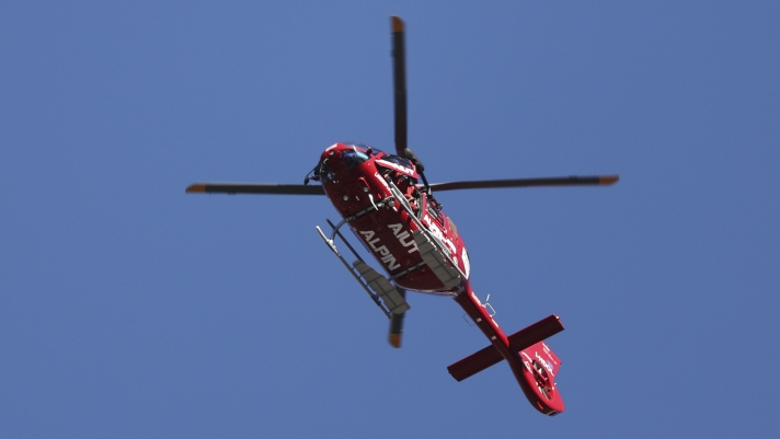 Emergencies helicopter takes Switzerland's Gino Caviezel to the hospital after his fall during an alpine ski, men's World Cup Super G race, in Bormio, Italy, Sunday, Dec. 29, 2024. (AP Photo/Marco Trovati)