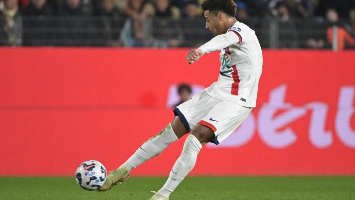 Paris Saint-Germain's French midfielder #14 Desire Doue shoots towards goal during the French Cup (Coupe de France) quarter final football match between Stade Briochin (Saint-Brieuc) and Paris Saint-Germain (PSG) at the Roazhon Park stadium in Rennes, western France, on February 26, 2025. (Photo by Damien MEYER / AFP)