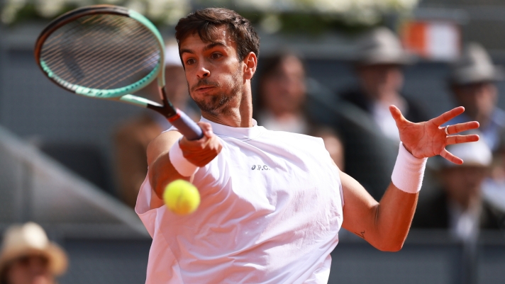 MADRID, SPAIN - APRIL 29: Lorenzo Musetti of Italy plays a forehand against Stefanos Tsitsipas of Greece in the Men's Singles Fourth Round match during Day Eight of the Mutua Madrid Open at La Caja Magica on April 29, 2025 in Madrid, Spain. (Photo by Clive Brunskill/Getty Images)