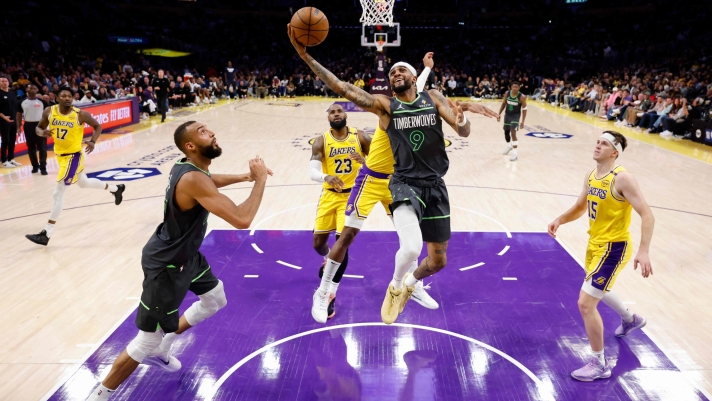 LOS ANGELES, CALIFORNIA - APRIL 30: Nickeil Alexander-Walker #9 of the Minnesota Timberwolves shoots the ball past Rui Hachimura #28 of the Los Angeles Lakers during the first halfin Game Five of the Western Conference First Round NBA Playoffs at Crypto.com Arena on April 30, 2025 in Los Angeles, California. NOTE TO USER: User expressly acknowledges and agrees that, by downloading and or using this photograph, User is consenting to the terms and conditions of the Getty Images License Agreement. Harry How/Getty Images/AFP (Photo by Harry How / GETTY IMAGES NORTH AMERICA / Getty Images via AFP)