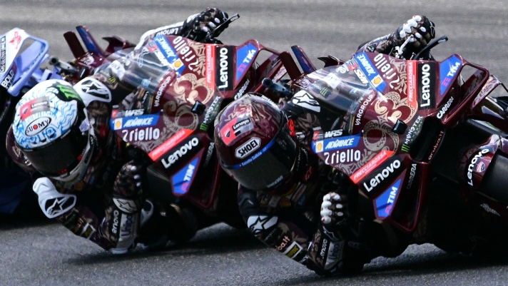 Ducati Lenovoi Team's Spanish MotoGP rider Marc Marquez steers his motorbike ahead of Ducati Lenovo Team's Italian MotoGP rider Francesco Bagnaia during the Italian Moto GP Grand Prix at Mugello circuit, in Mugello, near Florence, on June 22, 2025. (Photo by Tiziana FABI / AFP)