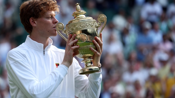 epa12236189 Jannik Sinner of Italy celebrates with the trophy after winning the Men's Singles final match against Carlos Alcaraz of Spain at the Wimbledon Championships, Wimbledon, Britain, 13 July 2025.  EPA/NEIL HALL  EDITORIAL USE ONLY
