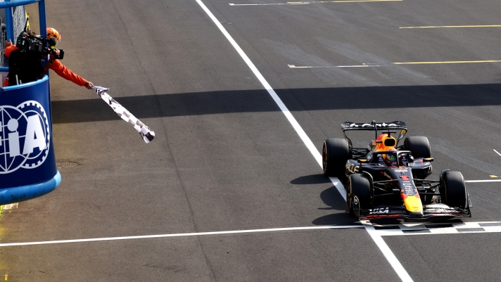 MONZA, ITALY - SEPTEMBER 07: Race winner Max Verstappen of the Netherlands driving the (1) Oracle Red Bull Racing RB21 takes the chequered flag during the F1 Grand Prix of Italy at Autodromo Nazionale Monza on September 07, 2025 in Monza, Italy. (Photo by Peter Fox/Getty Images)