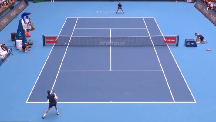 Carlos Alcaraz in action on a tennis court