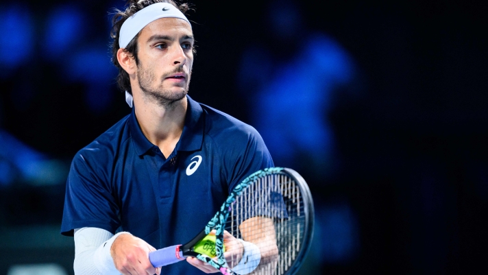 Italy's Lorenzo Musetti serves the ball to Germany's Alexander Zverev during the men's semi-final singles match at the ATP Vienna Open tennis tournament in Vienna, Austria, on October 25, 2025. (Photo by MAX SLOVENCIK / APA / AFP) / Austria OUT
