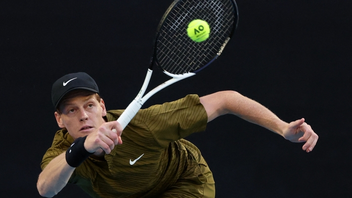Italy's Jannik Sinner hits a return to Australia's James Duckworth during their men's singles match on day five of the Australian Open tennis tournament in Melbourne on January 22, 2026. (Photo by DAVID GRAY / AFP) / -- IMAGE RESTRICTED TO EDITORIAL USE - STRICTLY NO COMMERCIAL USE --