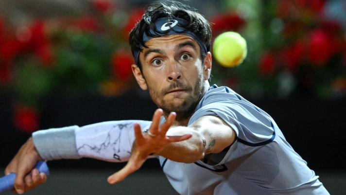 Lorenzo Musetti of Italy in action during his men's singles match against Giovanni Mpetshi Perricard of France (not pictured) at the Italian Open tennis tournament in Rome, Italy, 08 May 2026. ANSA/ALESSANDRO DI MEO