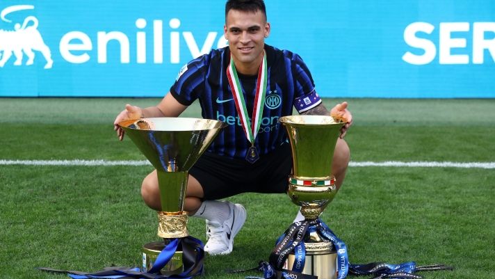 MILAN, ITALY - MAY 17: Lautaro Martinez of FC Internazionale Milano poses for a photo with the Coppa Campioni d'Italia and Coppa Italia trophies following the Serie A match between FC Internazionale and Hellas Verona FC at Giuseppe Meazza Stadium on May 17, 2026 in Milan, Italy. (Photo by Marco Luzzani/Getty Images)