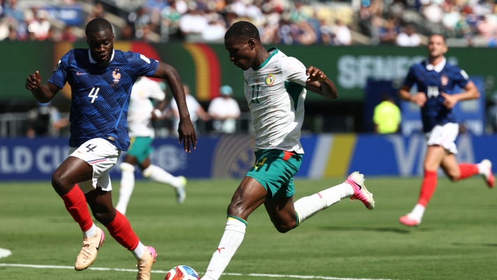 France's defender #04 Dayot Upamecano and Senegal's forward #11 Nicolas Jackson fight for the ball during the 2026 World Cup Group I football match between France and Senegal at the New York/New Jersey Stadium in East Rutherford on June 16, 2026.  (Photo by FRANCK FIFE / AFP)
