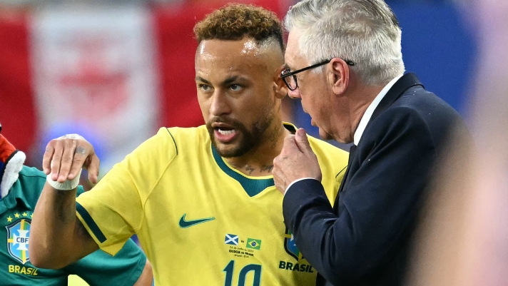 Brazil's Italian head coach Carlo Ancelotti talks to his forward #10 Neymar during the 2026 World Cup Group C football match between Scotland and Brazil at the Miami Stadium in Miami Gardens on June 24, 2026.  (Photo by CHANDAN KHANNA / AFP)