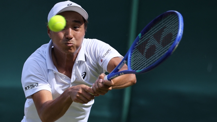 Japan's Shintaro Mochizuki returns to Spain's Rafael Jodar during their men's singles third round tennis match on the fifth day of the 2026 Wimbledon Championships at The All England Lawn Tennis and Croquet Club in Wimbledon, southwest London, on July 3, 2026. (Photo by Henry NICHOLLS / AFP) / RESTRICTED TO EDITORIAL USE