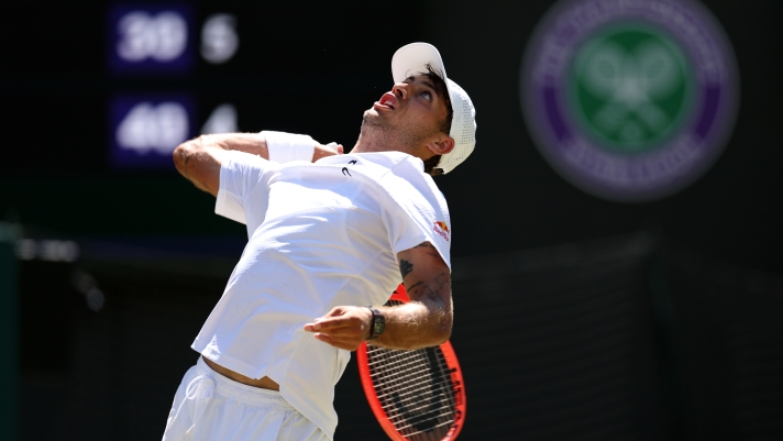 LONDON, ENGLAND - JULY 06: Flavio Cobolli of Italy serves against Alex De Minaur of Australia during their Gentlemen's Singles fourth round match on day eight of The Championships Wimbledon 2026 at All England Lawn Tennis and Croquet Club on July 06, 2026 in London, England. (Photo by Clive Brunskill/Getty Images)