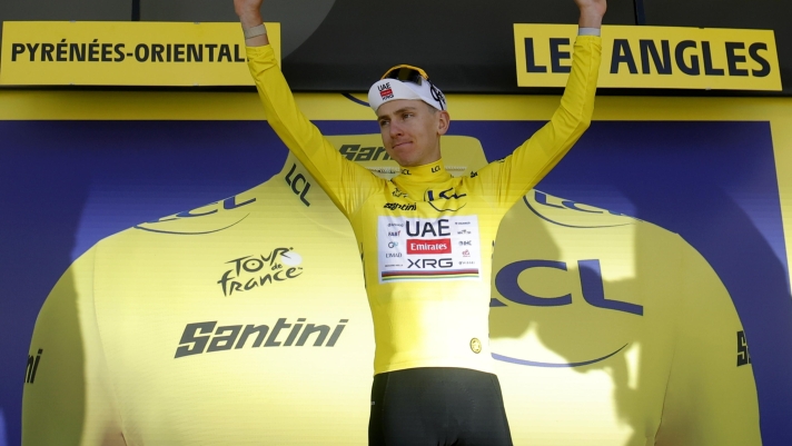 epa13092034 Slovenian cyclist Tadej Pogacar of UAE Team Emirates XRG celebrates on the podium wearing the overall leader's yellow jersey after winning Stage 3 of the Tour de France, a 195.9 km route from Granollers, Spain to Les Angles, France, 06 July 2026.  EPA/GUILLAUME HORCAJUELO