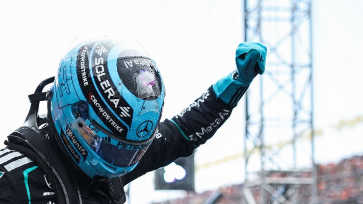 Mercedes' British driver George Russell gestures as he celebrates after winning the sprint race ahead of the Formula One Dutch Grand Prix at The Circuit Zandvoort, western Netherlands, on August 22, 2026. (Photo by SIMON WOHLFAHRT / AFP)