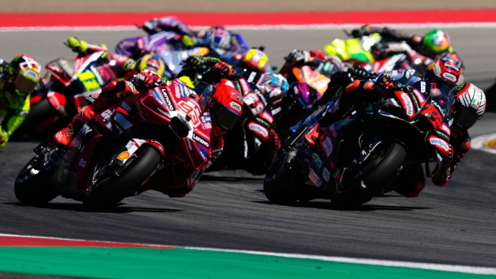 Spain's rider Marc Marquez of the Ducati Lenovo Team, left, steers his motorcycle followed by Italian rider Marco Bezzecchi of the Aprilia Racing during the MotoGP race of the Grand Prix of Aragon in Alcaniz, Spain, Sunday, Aug. 30, 2026. (AP Photo/Jose Breton)