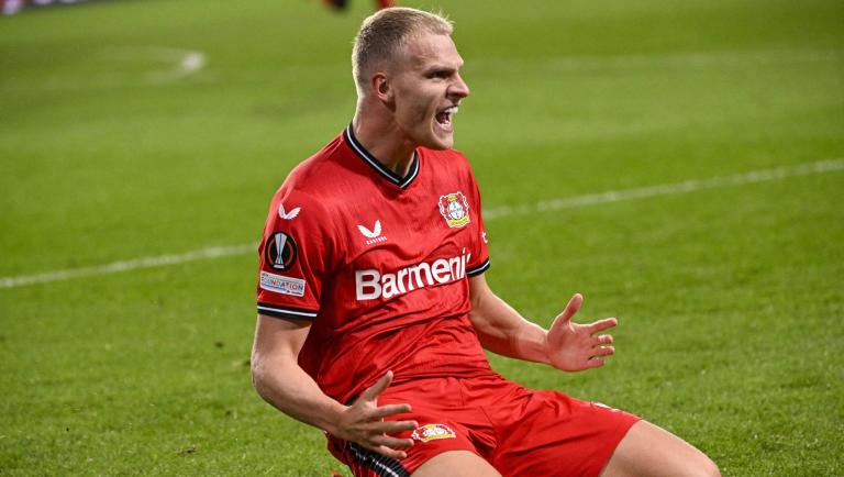 Leverkusen's Dutch defender Mitchel Bakker celebrates after scoring his team's second goal during the UEFA Europa League quarter-final second-leg football match between Union Saint-Gilloise and Bayer Leverkusen at the Anderlecht Stadium in Brussels, on April 20, 2023. (Photo by LAURIE DIEFFEMBACQ / BELGA / AFP) / Belgium OUT