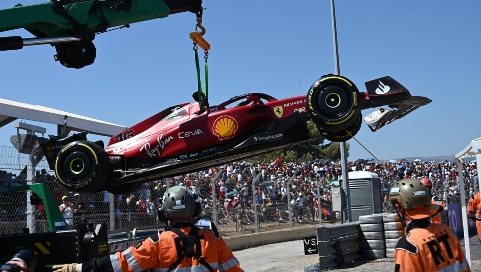The car of Ferrari's Monegasque driver Charles Leclerc is evacuated after he crashed during the French Formula One Grand Prix at the Circuit Paul-Ricard in Le Castellet, southern France, on July 24, 2022. (Photo by CHRISTOPHE SIMON / AFP)