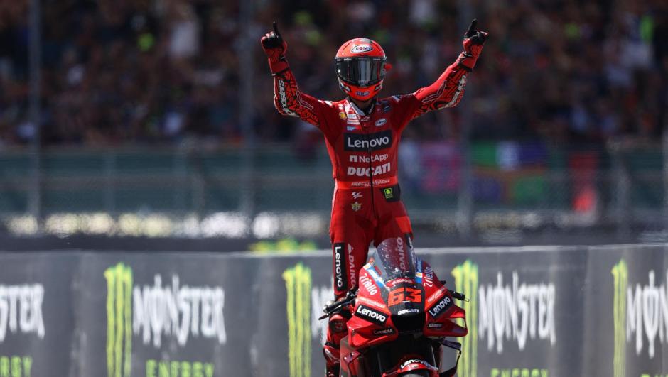 Ducati Lenovo's Italian rider Francesco Bagnaia celebrates his win in the MotoGP race of the British Grand Prix at Silverstone circuit in Northamptonshire, central England, on August 7, 2022. (Photo by ADRIAN DENNIS / AFP)