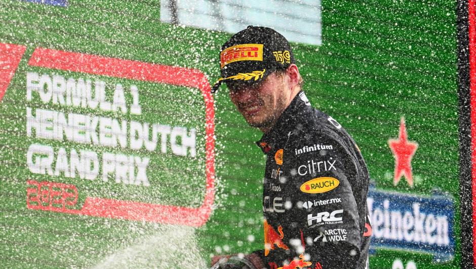 ZANDVOORT, NETHERLANDS - SEPTEMBER 04: Race winner Max Verstappen of the Netherlands and Oracle Red Bull Racing celebrates on the podium during the F1 Grand Prix of The Netherlands at Circuit Zandvoort on September 04, 2022 in Zandvoort, Netherlands. (Photo by Clive Mason/Getty Images)