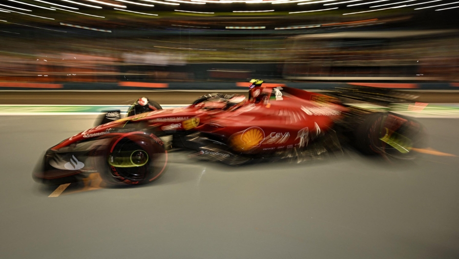 Ferrari's Spanish driver Carlos Sainz Jr drives in the pit lane during a practice session ahead of the Formula One Singapore Grand Prix night race at the Marina Bay Street Circuit in Singapore on September 30, 2022. (Photo by MOHD RASFAN / AFP)