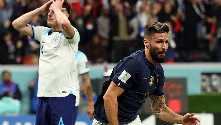 France's forward #09 Olivier Giroud celebrates scoring his team's second goal as England's midfielder #04 Declan Rice reacts during the Qatar 2022 World Cup quarter-final football match between England and France at the Al-Bayt Stadium in Al Khor, north of Doha, on December 10, 2022. (Photo by ADRIAN DENNIS / AFP)