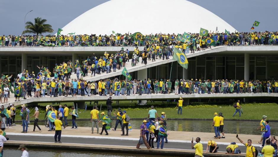 Protesters, supporters of Brazil's former President Jair Bolsonaro, storm the the National Congress building in Brasilia, Brazil, Sunday, Jan. 8, 2023. (AP Photo/Eraldo Peres)