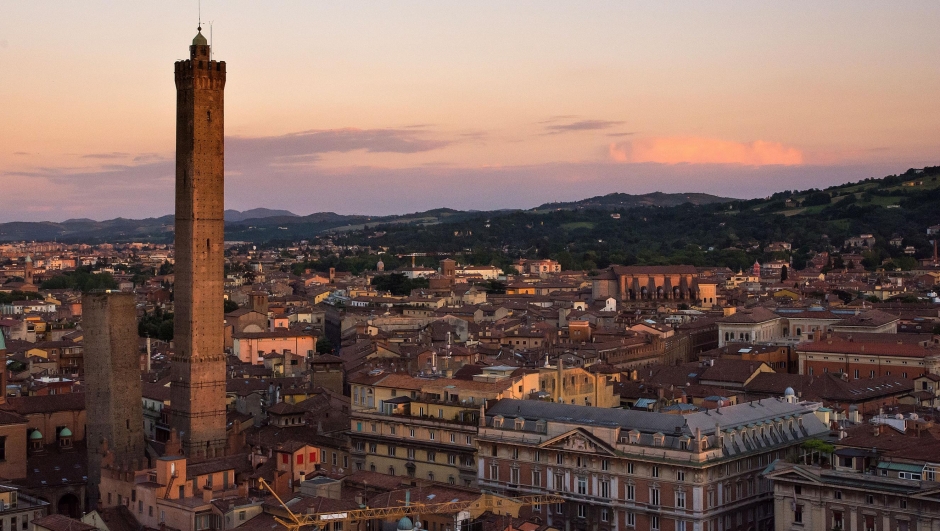 Bologna,Italy-May 17,2014:panorama of Bologna view from the famous "Prendiparte" tower located in the centre of the city.You can see the two towers and the red and old houses of the city.