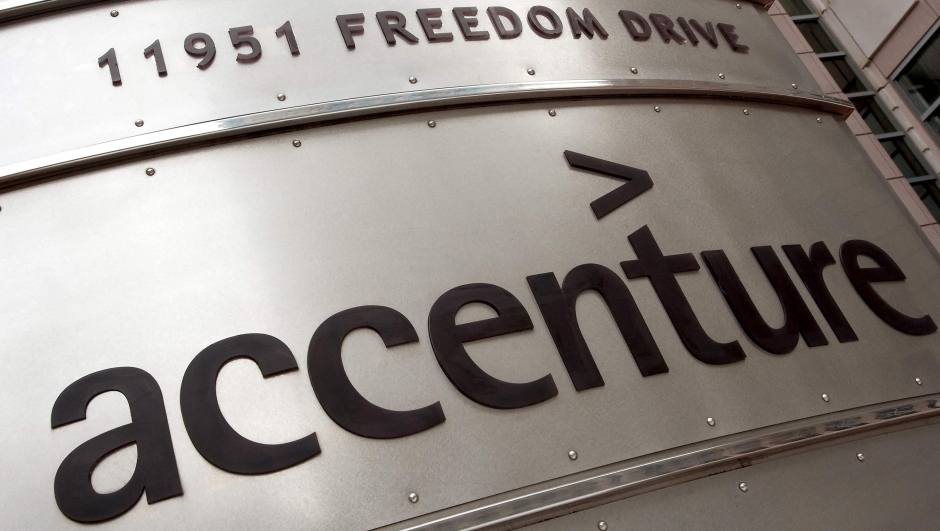 (FILES) In this file photo taken on December 21, 2009, Accenture logo outside their Reston, Virginia, offices. - Consulting firm Accenture announced on March 23, 2023, it will be cutting around 19,000 jobs, or 2.5 percent of its workforce, spread over the next 18 months, as part of a cost-cutting effort. In a filing with the US Securities and Exchange Commission, the Dublin-headquartered company said it expects to incur $1.5 billion in costs as a result of the downsizing, including $1.2 billion directly related to the layoffs. (Photo by Paul J. RICHARDS / AFP)