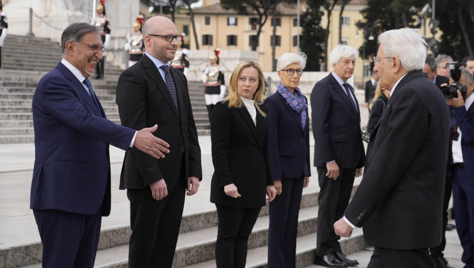 Italian President Sergio Mattarella, right, is welcomed by Italian Senate President Ignazio La Russa at the unknown soldier monument during a ceremony to mark Italy's Liberation day, in Rome, Tuesday, April 25, 2023. The anniversary marks the day in 1945 when the Italian resistance movement proclaimed an insurgency as the Allies were pushing German forces out of the peninsula. (AP Photo/Gregorio Borgia