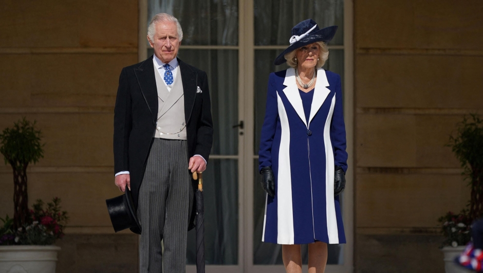 TOPSHOT - Britain's King Charles III and Britain's Camilla, Queen Consort arrive to meet the guests attending the Garden Party at Buckingham Palace, in London, on May 3, 2023 to celebrate their coronation ceremony as King and Queen of the United Kingdom and Commonwealth Realm nations, on May 6, 2023. (Photo by Yui Mok / POOL / AFP)