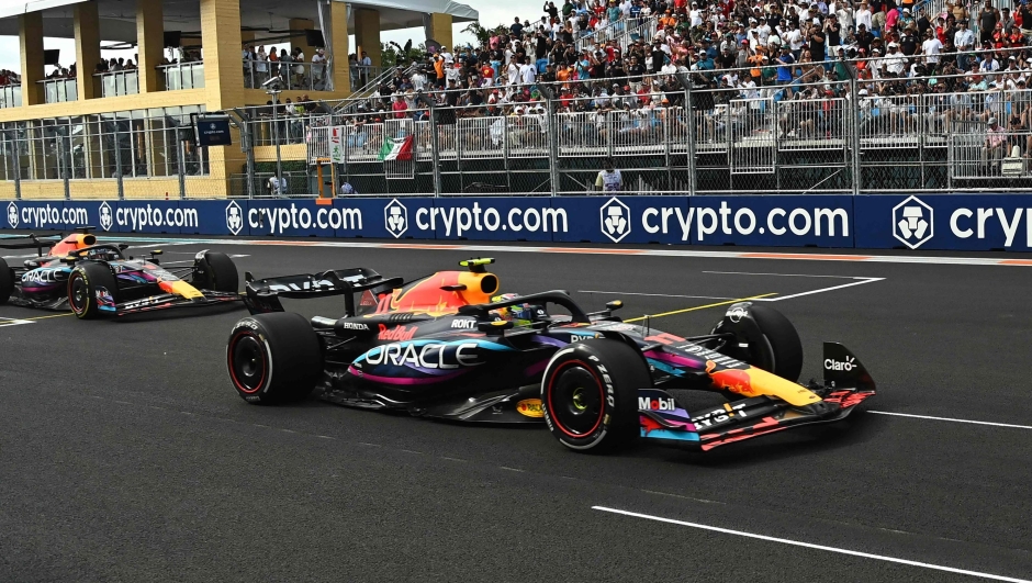 Red Bull Racing's Mexican driver Sergio Perez leads teammate Dutch driver Max Verstappen during the 2023 Miami Formula One Grand Prix at the Miami International Autodrome in Miami Gardens, Florida, on May 7, 2023. (Photo by CHANDAN KHANNA / POOL / AFP)