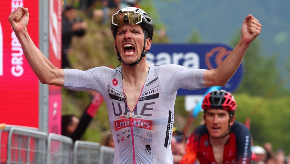 UAE Team Emirates's Portuguese rider Joao Almeida celebrates as he crosses the finish line to win the sixteenth stage of the Giro d'Italia 2023 cycling race, 203 km between Sabbio Chiese and Monte Bondone, near Cavedine, on May 23, 2023. (Photo by Luca Bettini / AFP)