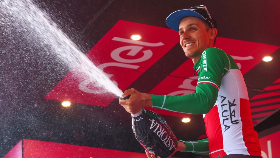 Team Jayco AlUla's Filippo Zana rider celebrates on the podium after winning the eighteenth stage of the Giro d'Italia 2023 cycling race, 161 km between Oderzo and Val di Zoldo, on May 25, 2023. . (Photo by Luca Bettini / AFP)