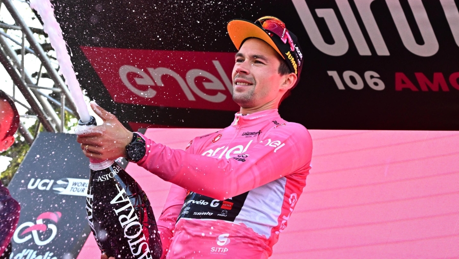 Slovenian rider  Primoz Roglic of team Jumbo Visma team wearing the overall leader's pink jersey celebrates on the podium the overall leader's pink jersey after  the twentyth stage ITT of the 2023 Giro d'Italia cycling race over  km 18,6 from Tarvisio to Monte Lussari, Italy, 27May 2023. ANSA/LUCA ZENNARO