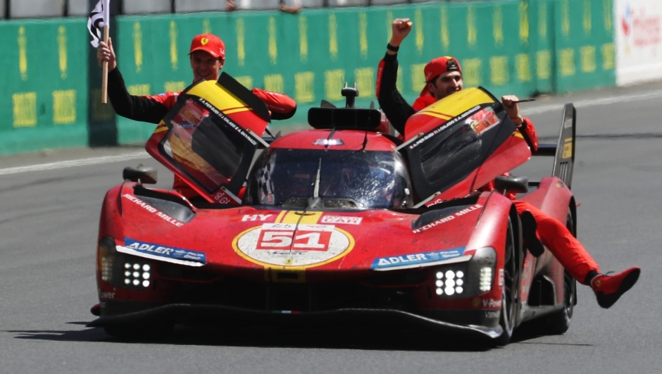 LE MANS, FRANCE - JUNE 11: The race winning Ferrari AF Corse Ferrari 499P of  Alessandro Pier Guidi (driving), James Calado (L) and Antonio Giovinazzi (R) celebrate at the finish of the 100th anniversary 24 Hours of Le Mans race at the Circuit de la Sarthe June 11, 2023 in Le Mans, France. (Photo by Ker Robertson/Getty Images)