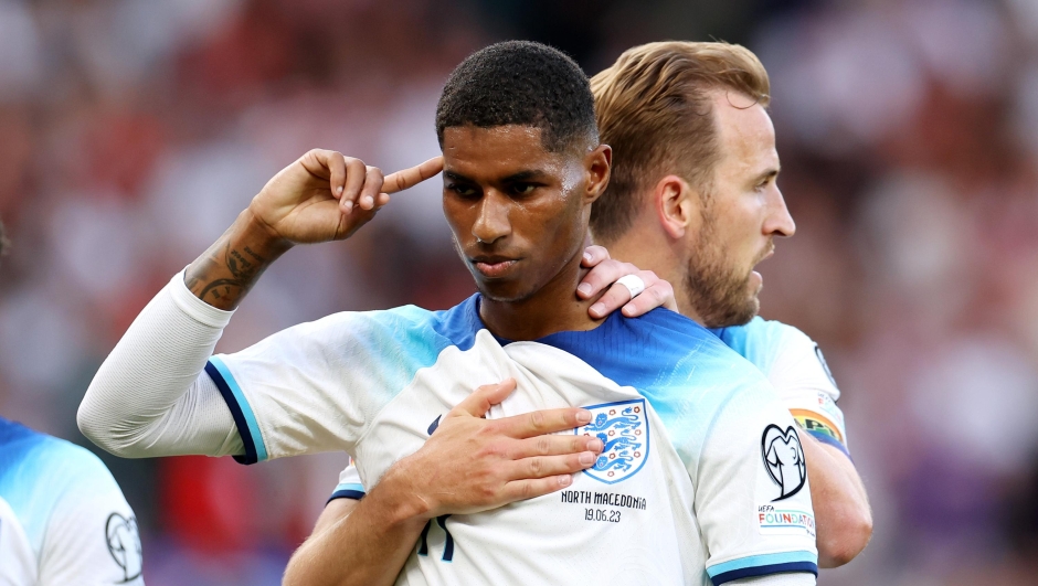 MANCHESTER, ENGLAND - JUNE 19: Marcus Rashford of England celebrates with teammate Harry Kane after scoring the team's third goal during the UEFA EURO 2024 qualifying round group C match between England and North Macedonia at Old Trafford on June 19, 2023 in Manchester, England. (Photo by Catherine Ivill/Getty Images)