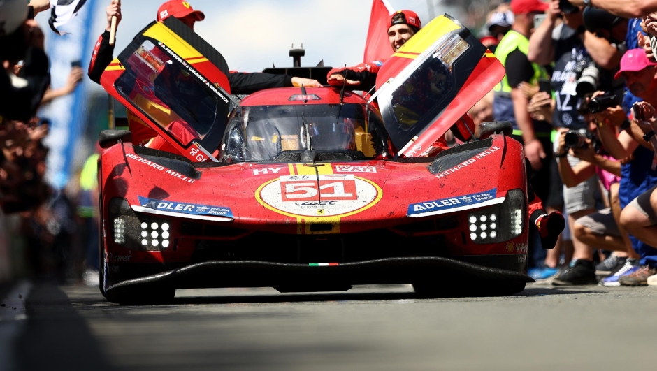 LE MANS, FRANCE - JUNE 11: The No.50 Ferrari AF Corse Ferrari 499P of Alessandro Pier Guidi, James Calado and Antonio Giovinazzi drives down the pit lane to celebrate after winning the 100th anniversary of the 24 Hours of Le Mans at the Circuit de la Sarthe June 11, 2023 in Le Mans, France. (Photo by Clive Rose/Getty Images)