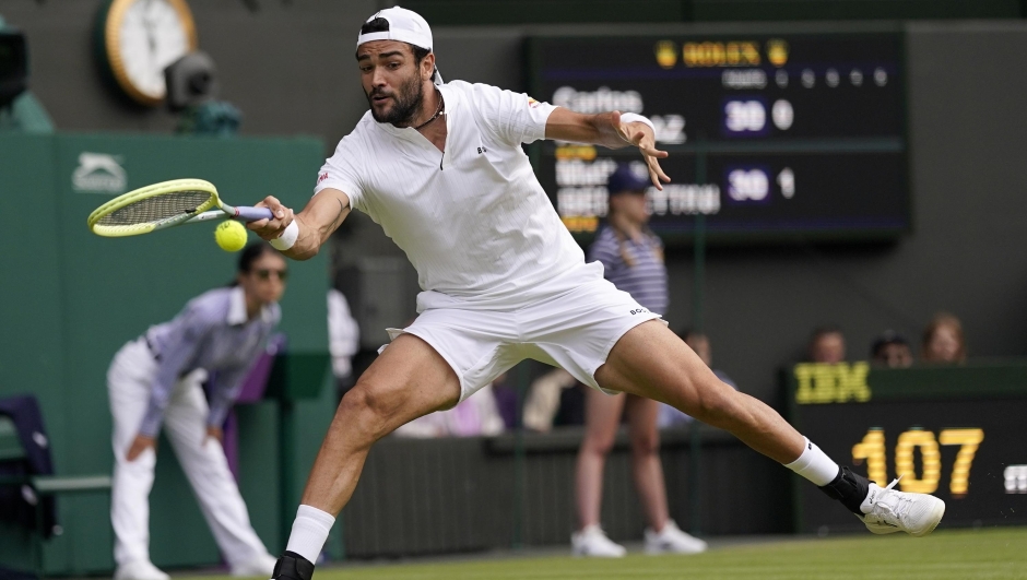 Italy's Matteo Berrettini returns to Spain's Carlos Alcaraz in a men's singles match on day eight of the Wimbledon tennis championships in London, Monday, July 10, 2023. (AP Photo/Alberto Pezzali)