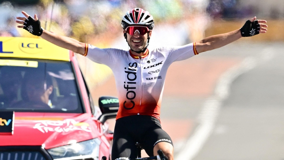 Cofidis' Spanish rider Ion Izaguirre Insausti cycles to the finish line to win the 12th stage of the 110th edition of the Tour de France cycling race, 169 km between Roanne and Belleville-en-Beaujolais, in central-eastern France, on July 13, 2023. (Photo by Marco BERTORELLO / AFP)