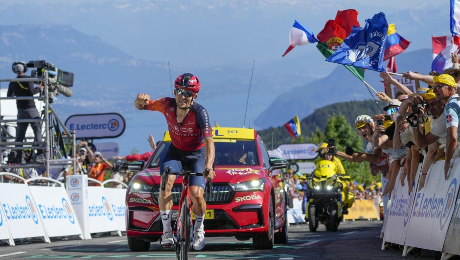 Poland's Michal Kwiatkowski crosses the finish line to win the thirteenth stage of the Tour de France cycling race over 138 kilometers (86 miles) with start in Chatillon-sur-Chalaronne and finish on Grand Colombier pass, France, Friday, July 14, 2023. (AP Photo/Thibault Camus)