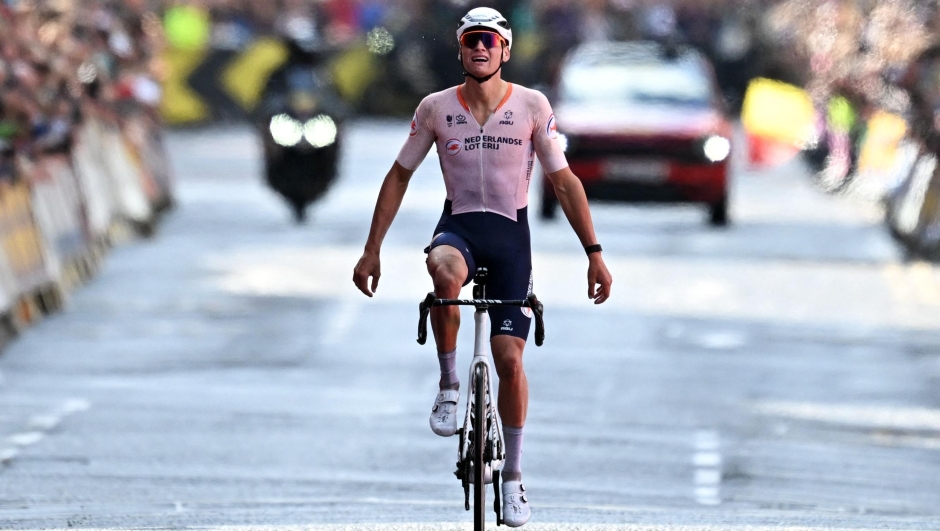 Netherland's Mathieu van der Poel reacts after winning the men's Elite Road Race at the Cycling World Championships in Edinburgh, Scotland on August 6, 2023. men's Elite Road Race at the Cycling World Championships in Edinburgh, Scotland on August 6, 2023. Netherland's Mathieu van der Poel took first place in the race that began in Scotland's capital city, Edinburgh, and ended with a street circuit in Glasgow. Belgium's Wout van Aert came second with Slovenia's Tadej Pogacar finishing in third place. (Photo by Oli SCARFF / AFP)