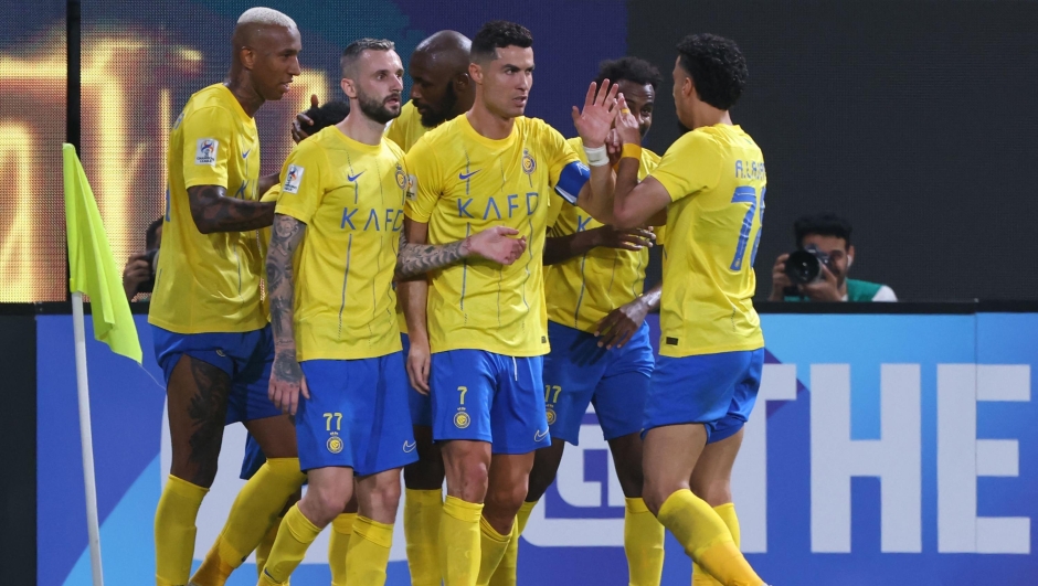 Nassr's Portuguese forward #07 Cristiano Ronaldo celebrates with teammates after their third goal during the AFC Champions League group E football match between Saudi al-Nassr SC and Tajikistan's FC Istiklol at King Saud University Stadium in Riyadh on October 2, 2023. (Photo by Fayez NURELDINE / AFP)
