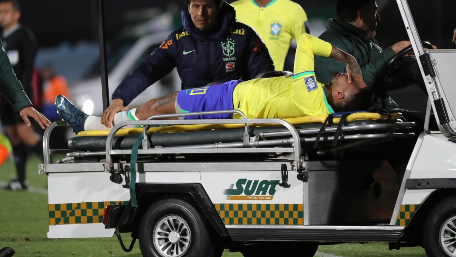 epaselect epa10924731 Brazil's Neymar reacts while being assisted to leave the field for a possible injury during a CONMEBOL FIFA World Cup 2026 qualifier soccer match between Uruguay and Brazil at Centenario stadium in Montevideo, Uruguay, 17 October 2023.  EPA/Raul Martinez