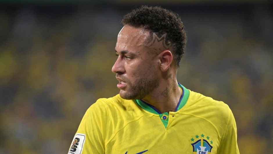 (FILES) Brazil's forward Neymar gestures during the 2026 FIFA World Cup South American qualification football match between Brazil and Venezuela at the Arena Pantanal stadium in Cuiaba, Mato Grosso State, Brazil, on October 12, 2023. Football superstar Neymar will undergo surgery Thursday in his native Brazil after tearing a ligament and meniscus in his left knee during a national team match last month, the Brazilian Football Confederation (CBF) said on November 1st. (Photo by NELSON ALMEIDA / AFP)