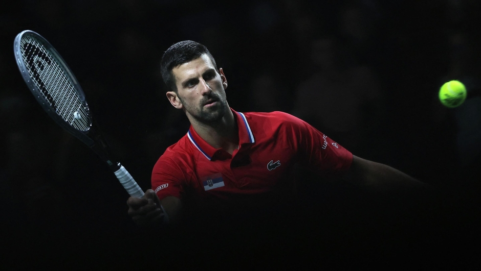Serbia's Novak Djokovic returns the ball against Britain's Cameron Norrie during the second men's doubles quarter-final tennis match between Serbia and Great Britain of the Davis Cup tennis tournament at the Martin Carpena sportshall, in Malaga on November 23, 2023. (Photo by LLUIS GENE / AFP)