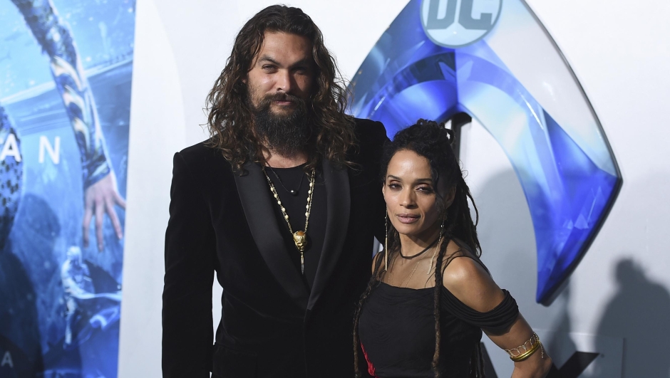 FILE - Jason Momoa, left, and Lisa Bonet, right, arrive at the premiere of "Aquaman" at TCL Chinese Theatre, Dec. 12, 2018, in Los Angeles. On Monday, Jan. 8, 2024, Bonet filed for divorce from Momoa, 18 years after the two actors became a couple. (Photo by Jordan Strauss/Invision/AP, File)