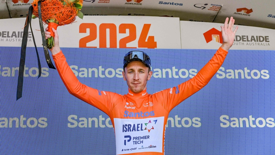 Race leader Britain's Stephen Williams of Israel Premier Tech celebrates on the podium after the fifth stage of the Tour Down Under cycling race in Adelaide on January 20, 2024. (Photo by Brenton EDWARDS / AFP) / -- IMAGE RESTRICTED TO EDITORIAL USE - STRICTLY NO COMMERCIAL USE --