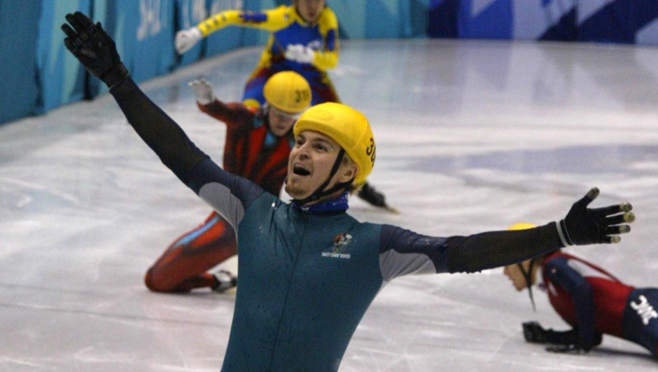 Steven Bradbury (front) of Australia celebrates his gold after skating past Mathieu Turcotte of Canada, Ahn Hyun-soo (rear) of South Korea and Li Jiajun (R) of China when they crashed just before the finishing line during the men's 1000m short track final during the Salt Lake 2002 Olympic Winter Games, February 16, 2002. Bradbury won Australia's first-ever gold medal at the Winter Olympics on Saturday when he won an extraordinary 1,000 meters final at short track speedskating. REUTERS/David Gr ay